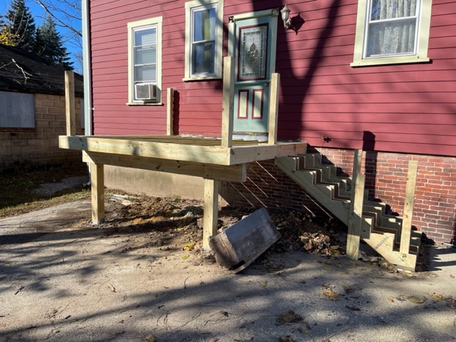 The Northeast Contracting Solutions crew built this deck and stairs to replace a rotted deck for this resident in Haverhill, MA.