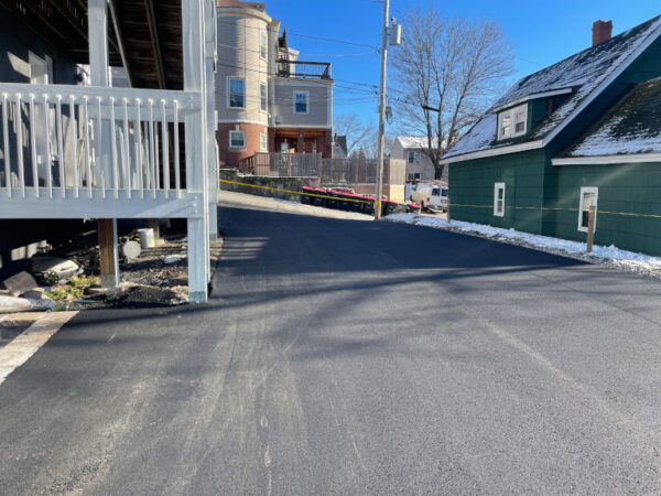 Northeast Contracting Solutions prepped, repaired, and paved this driveway and connecting areas for this property in Haverhill, MA.

