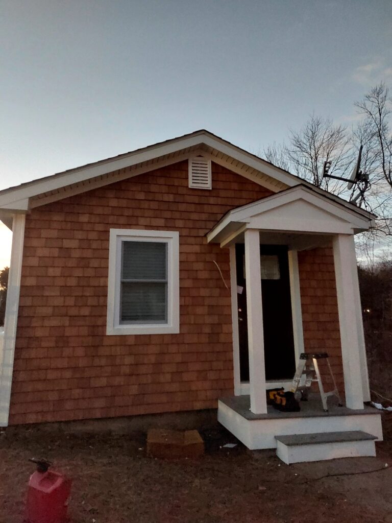 Northeast Contracting Solutions repaired and refinished the exterior of this residence in Windham, NH.